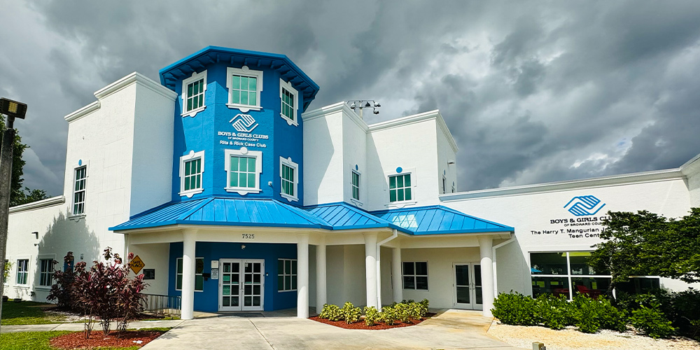 RIta and Rick Case Club | Bright blue and white building.