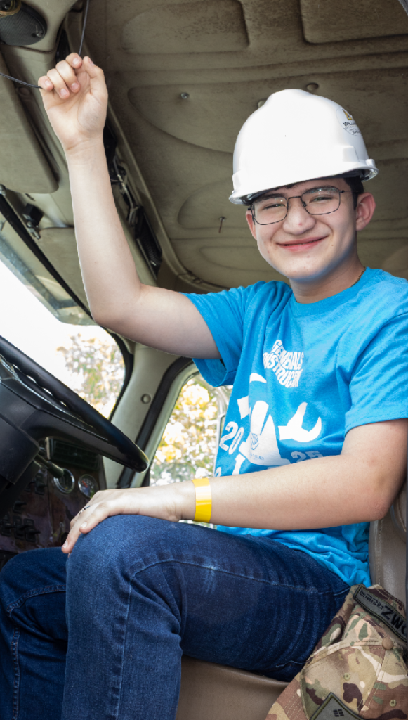 BGCBC Club Member in Construction vehicle on Career Day
