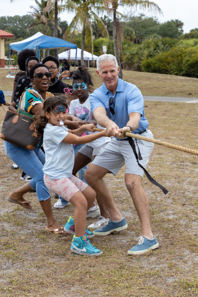 Family Fun Tug-of-War with Boys and Girls Club staff and members.