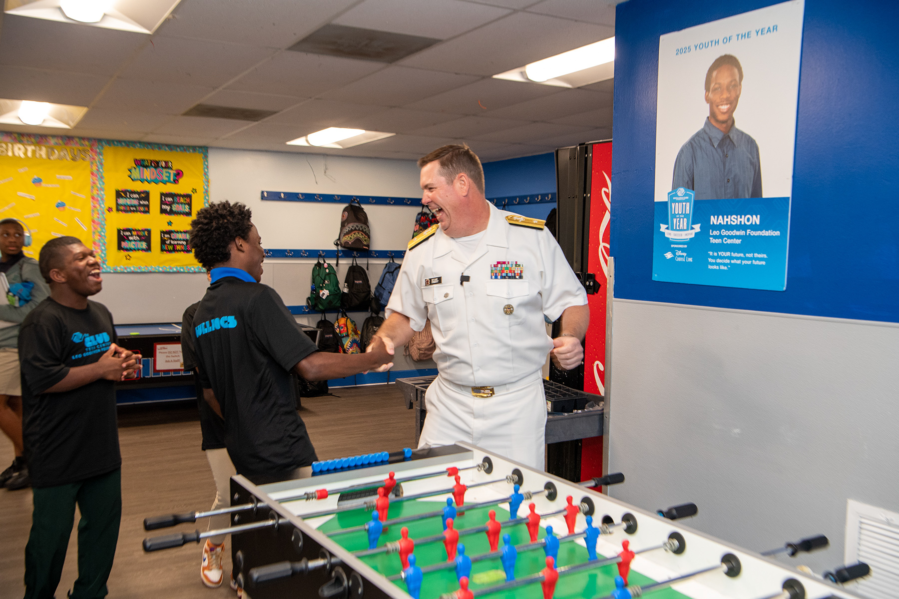 Rear Admiral Ryan M. Perry visiting his club as an alumni.