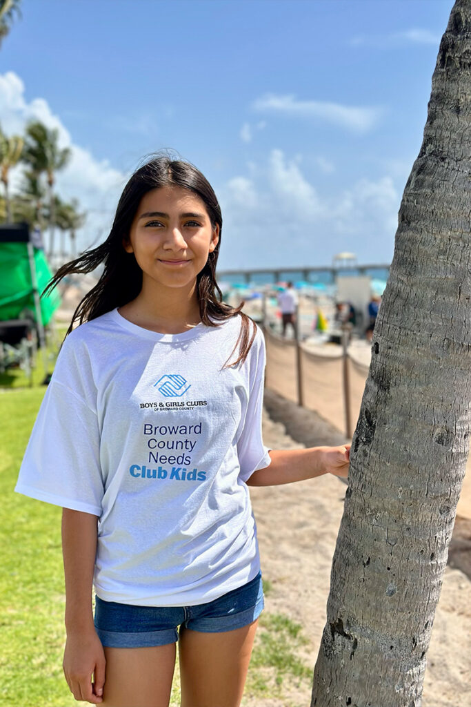 Club Member wearing Broward County Needs Club Kids shirt