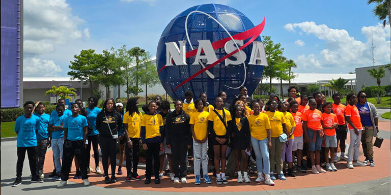 June 2025, Boys and Girls Club of Broward County Club Memebers at the Kennedy Space Museum, infront of a NASA Statue