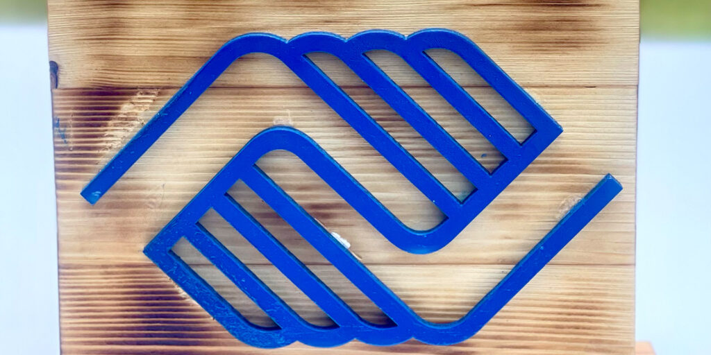 The Boys and girls club logo encased in wood