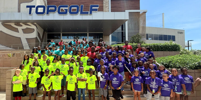 Boys and Girls club members of Broward County in front of TopGolf