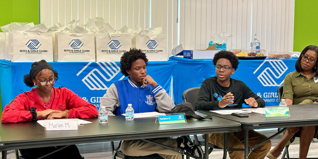 The "United for Youth" roundtable event's remarkable teen voices : Marlee M., Nashon H., and Jakeclaude M. They sit at a table ready to begin the event.
