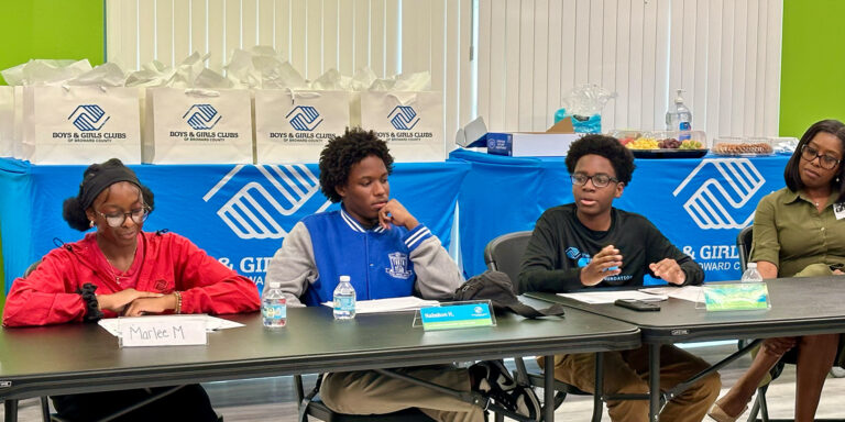 The "United for Youth" roundtable event's remarkable teen voices : Marlee M., Nashon H., and Jakeclaude M. They sit at a table ready to begin the event.