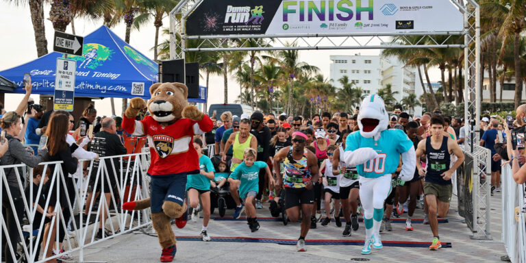 January 2026 Dunn's Run Starting line with the panthers & Dolphins mascots and people, from a featured story in the January Newsletter