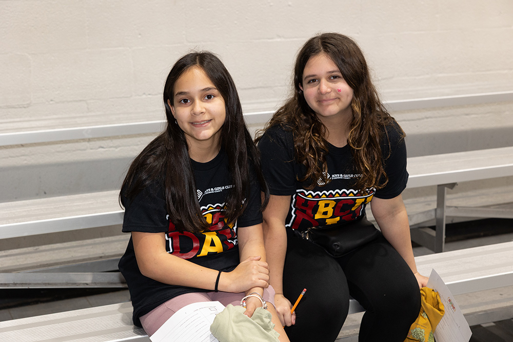 Two BGCBC Club Members smiling and wearing HBCU Day shirts at the event