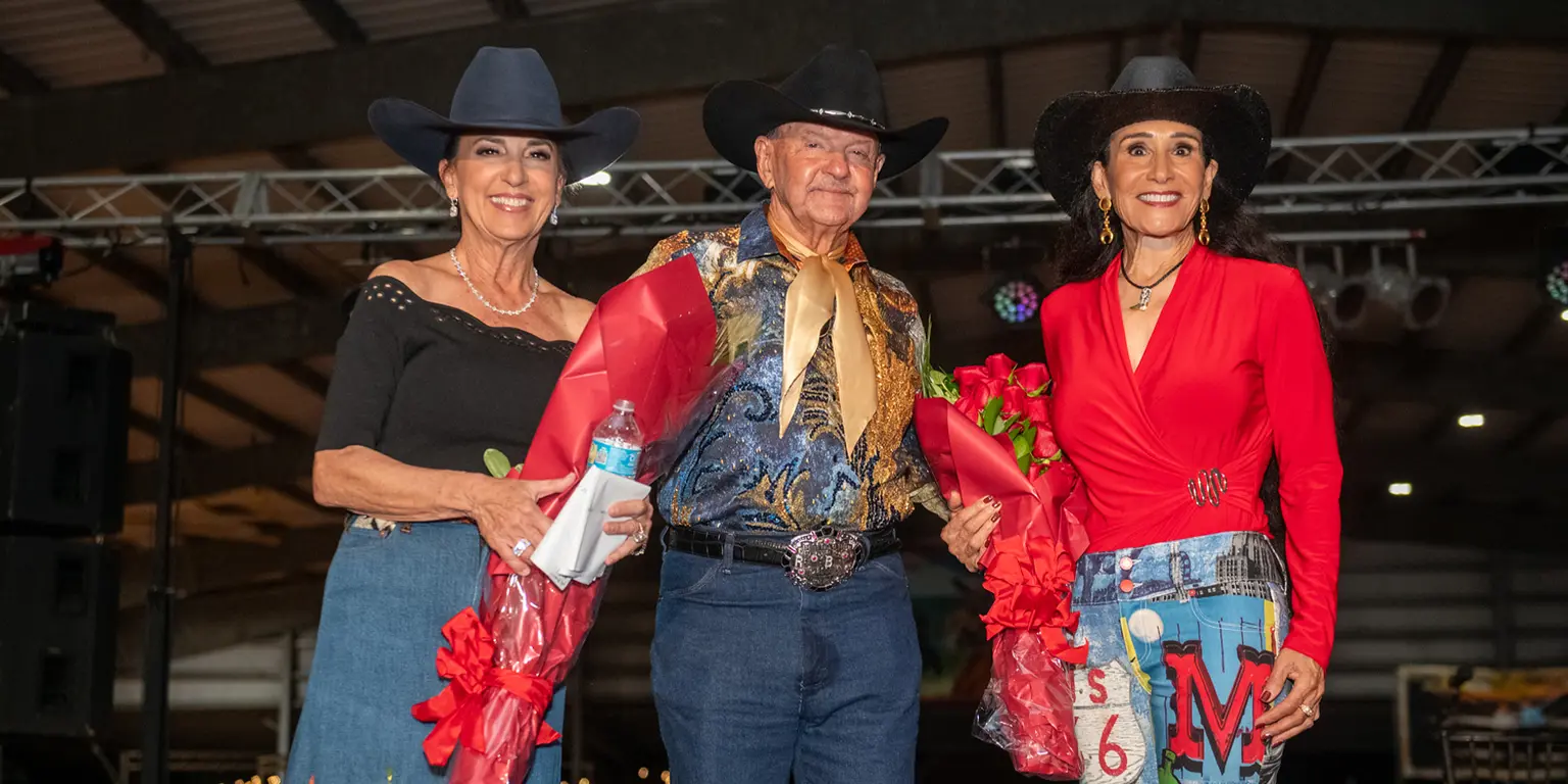 “Alligators” Ron & Ali Bergeron smiling alongside Rita Case at the Ranch Roam Event.