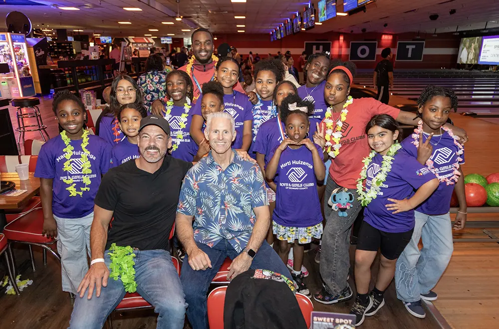 Twelve Boys & Girls Clubs of Broward County club members posing with BGCBC Staff, Administrative staff, and others who made the event possible