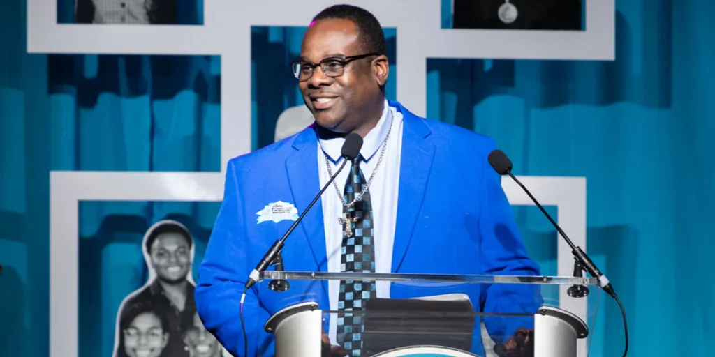 Markes Thomas on stage after being inducted into the Boys & Girls Club Hall of Fame.