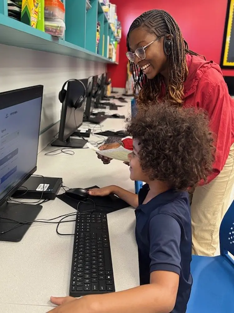 A BGCBC Club member smiling as they are guided by BGCBC staff